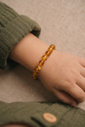 Barnsteen armbandje – ronde kraaltjes – 14 cm – Honing