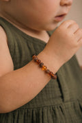 Barnsteen armbandje – ronde kraaltjes – gepolijst/ruw – 14 cm – Cognac