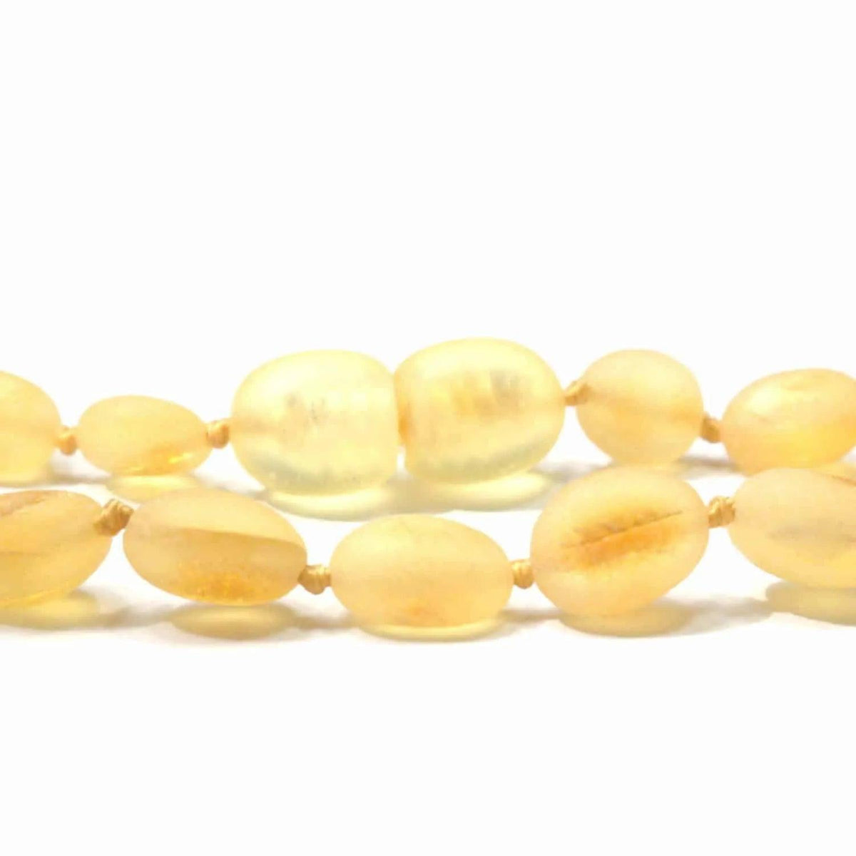 Barnsteen armbandje – ovalen ruwe kraaltjes – Citroen – 14 cm