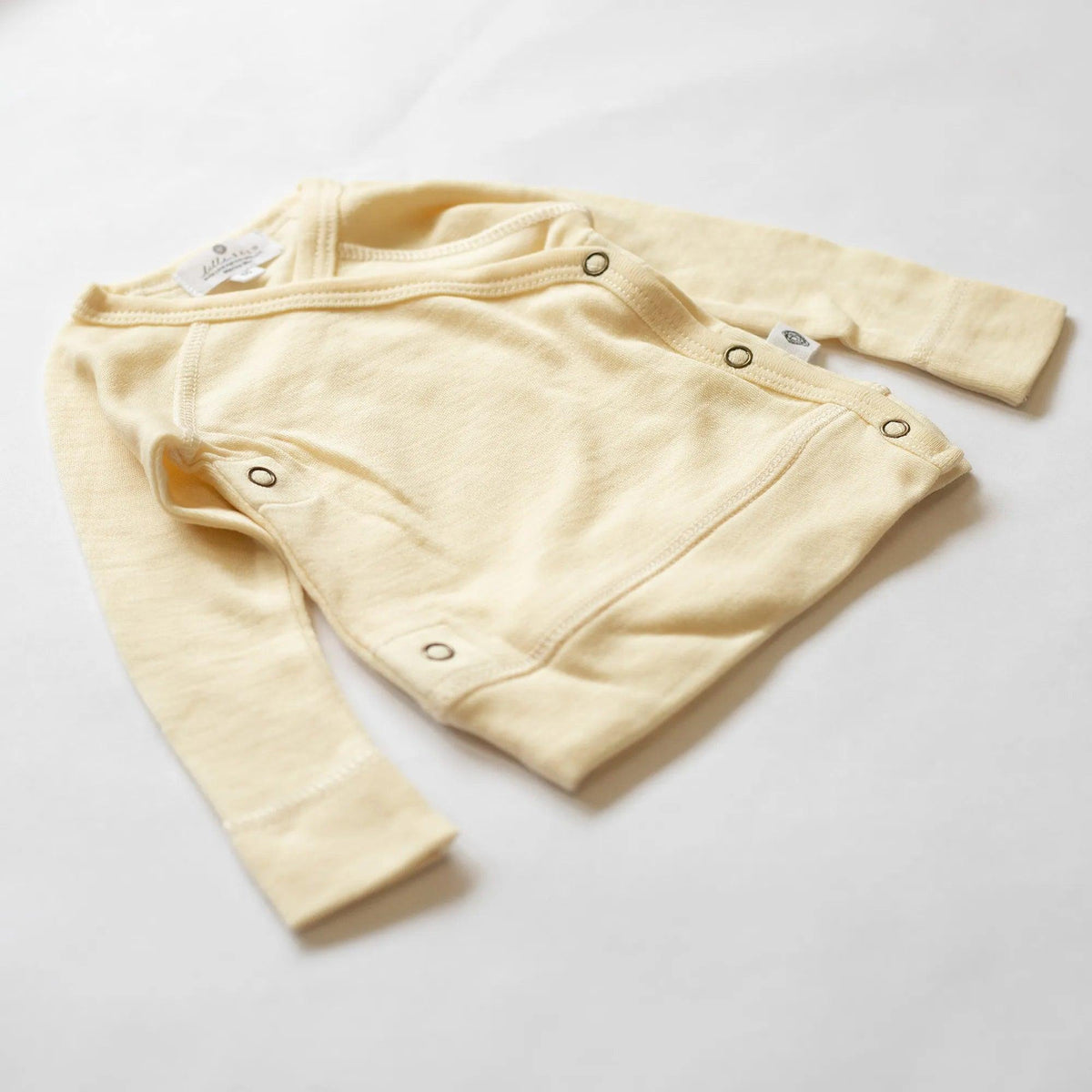 Baby wollen overslagtrui – merinowol – Naturel