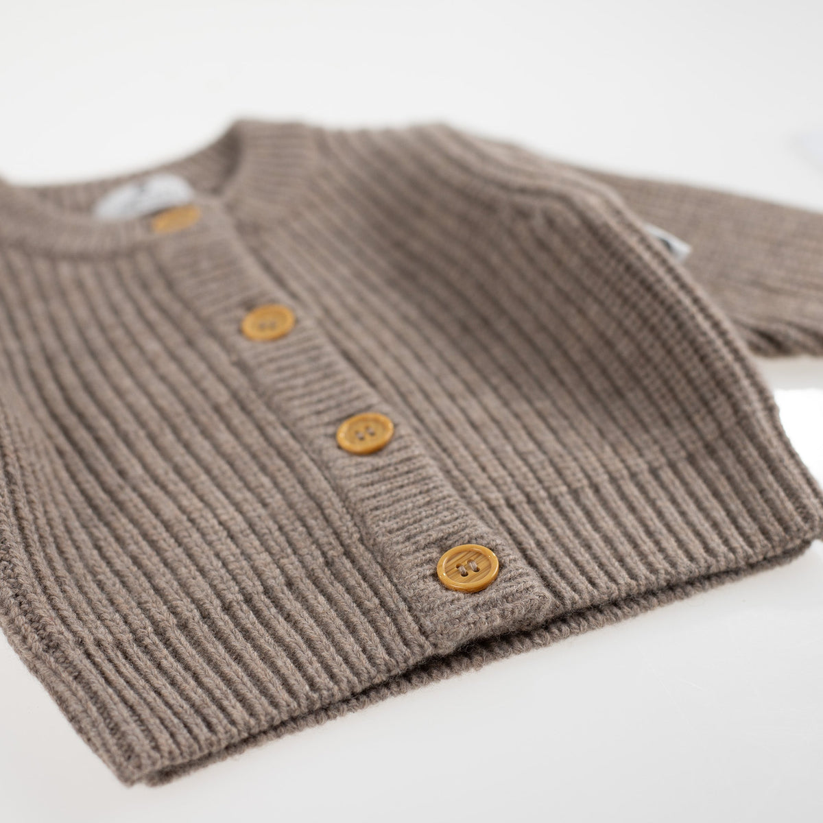 Gebreid wollen babyvestje – merinowol – Cobble