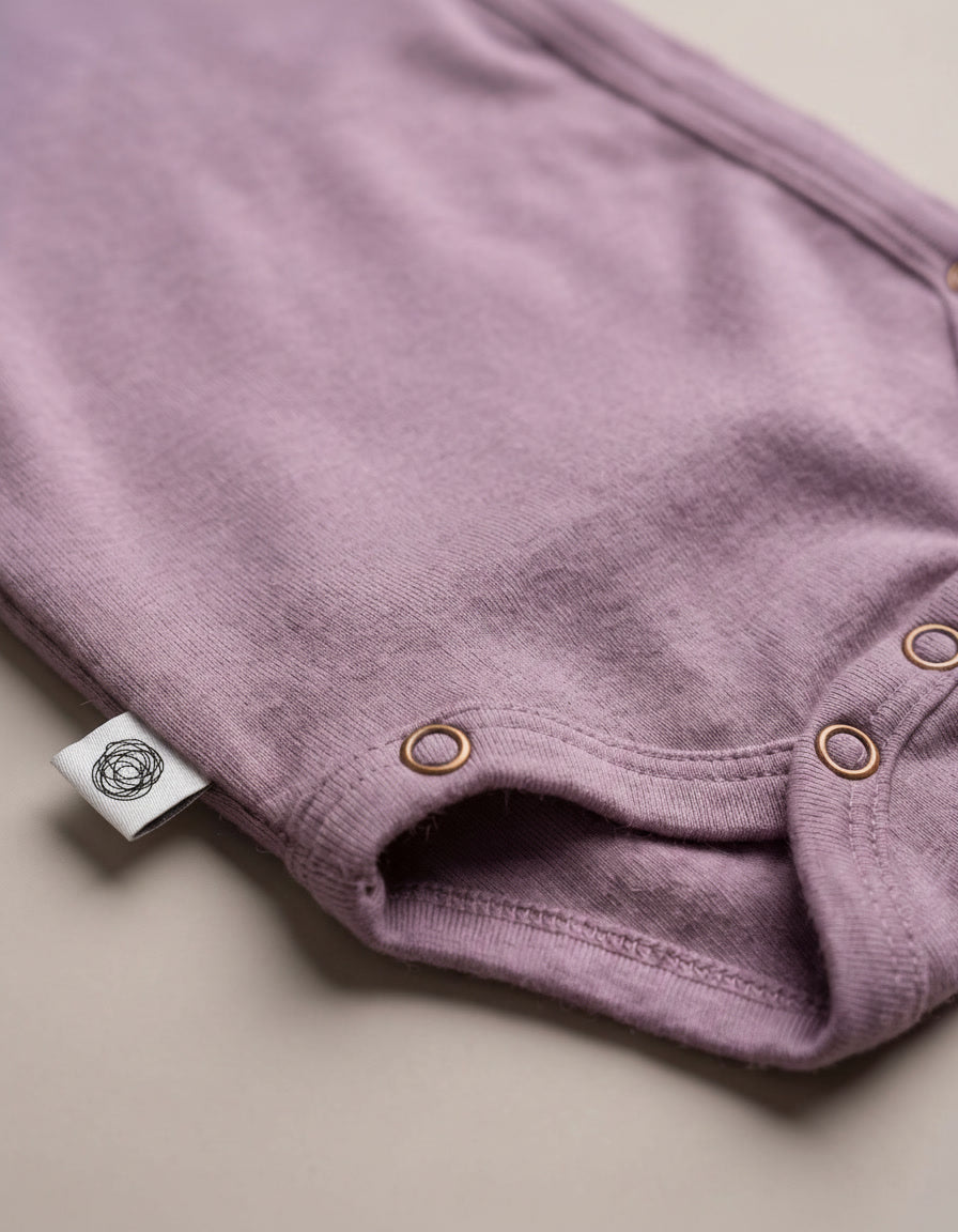 Wollen overslagromper lange mouw – merinowol – Lavender Mist
