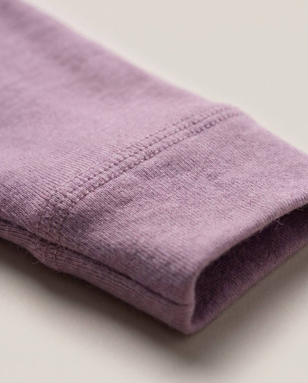 Wollen overslagromper lange mouw – merinowol – Lavender Mist