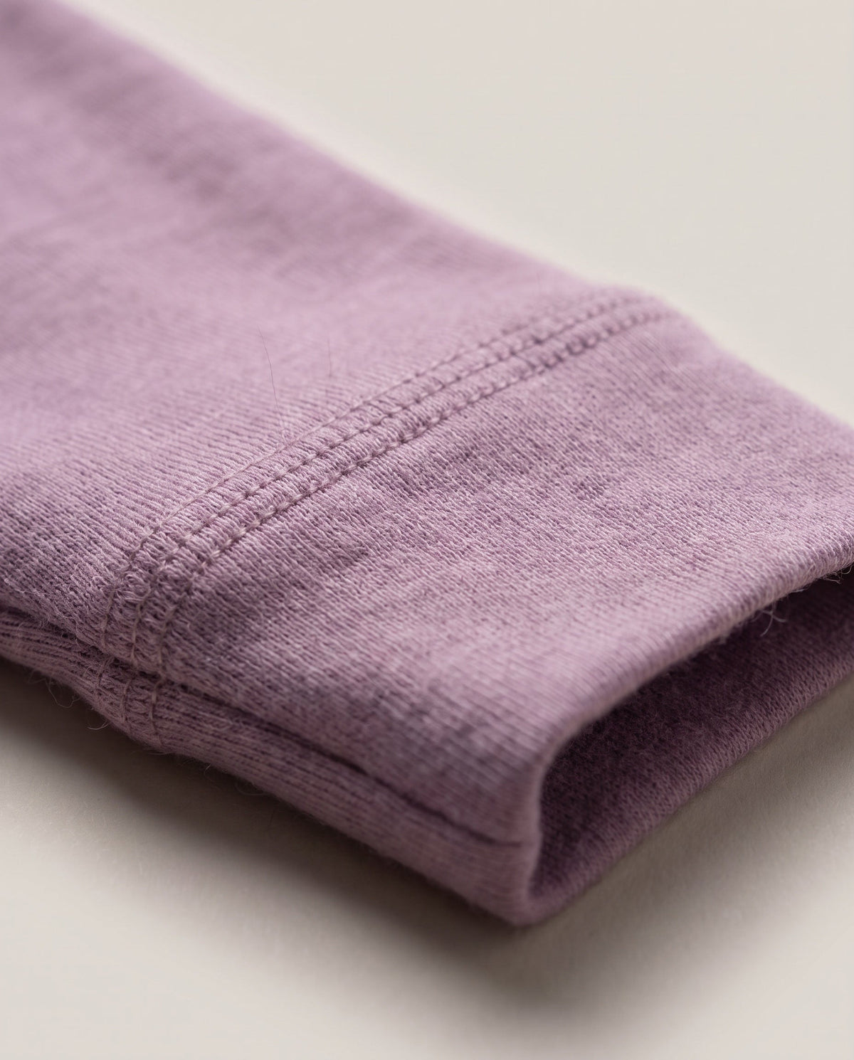 Wollen overslagromper lange mouw – merinowol – Lavender Mist