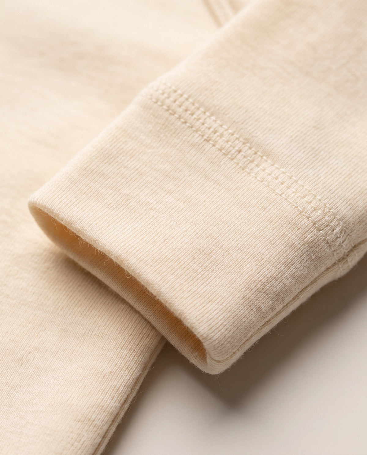 Wollen overslagromper lange mouw – merinowol – Naturel