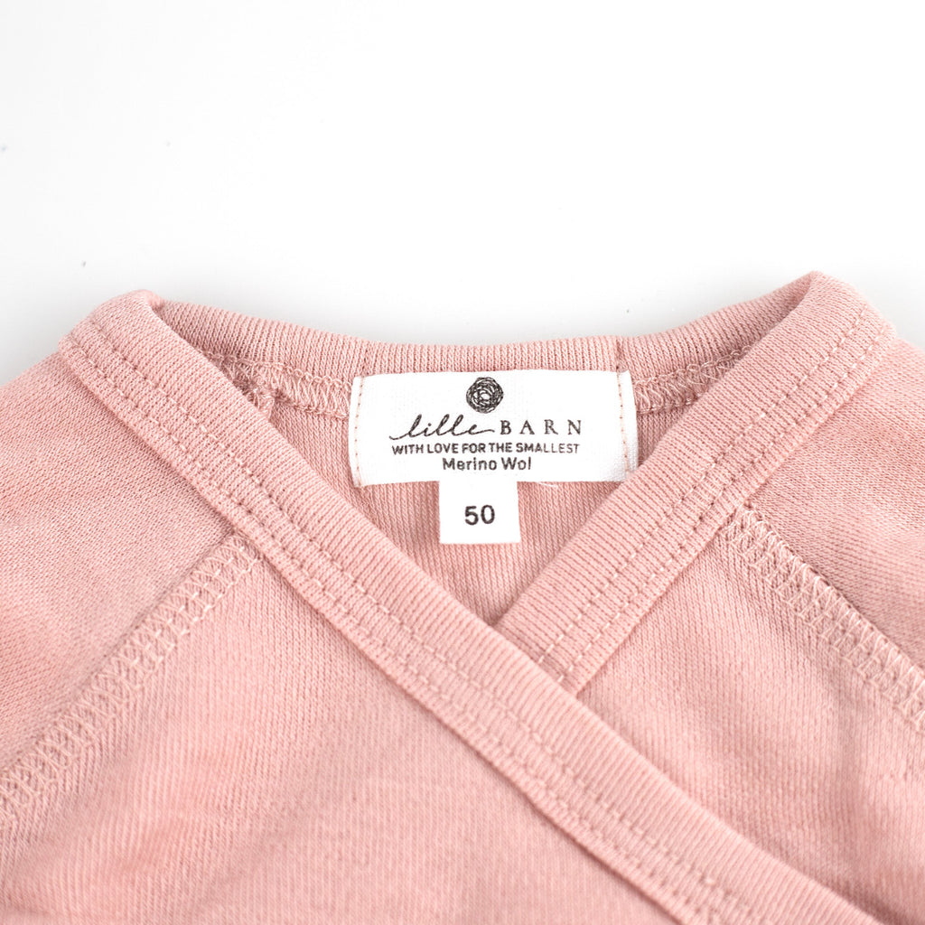 Wollen overslagromper lange mouw – merinowol – Misty Rose