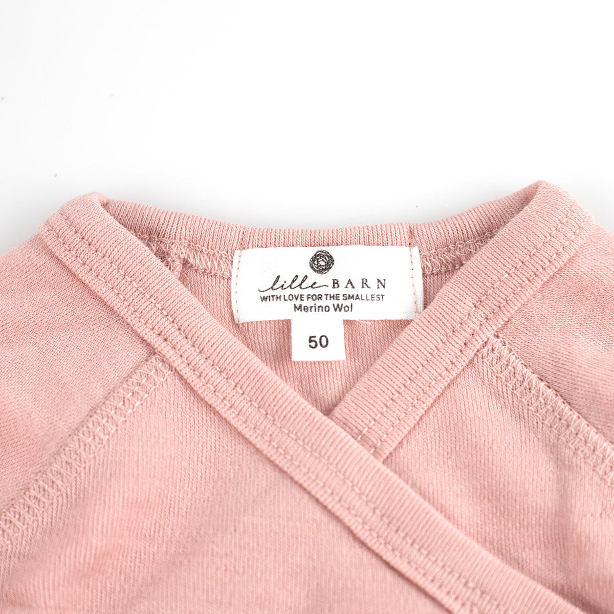 Wollen overslagromper lange mouw – merinowol – Misty Rose